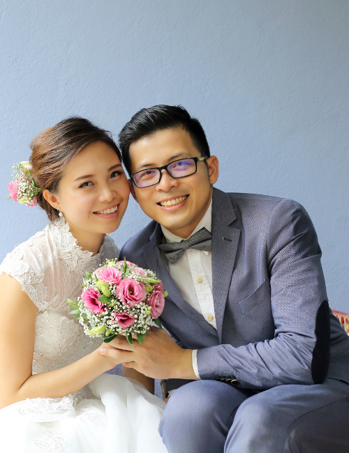 Asian bride and groom smiling